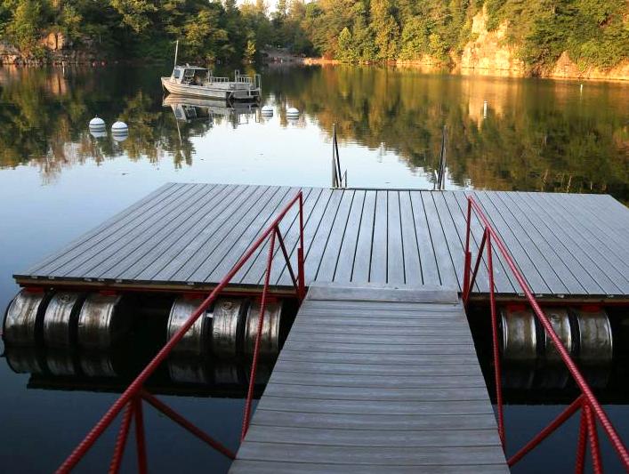 The diving platform at Mermet Springs in Illinois with a small boat in the background